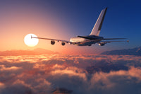 Airplane above the clouds Wall Art
