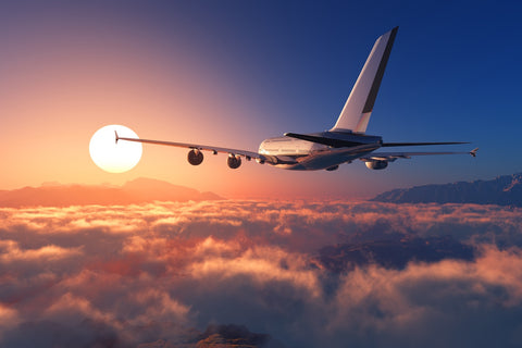 Airplane above the clouds Wall Art